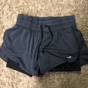 Charcoal gray running shorts with spandex lining